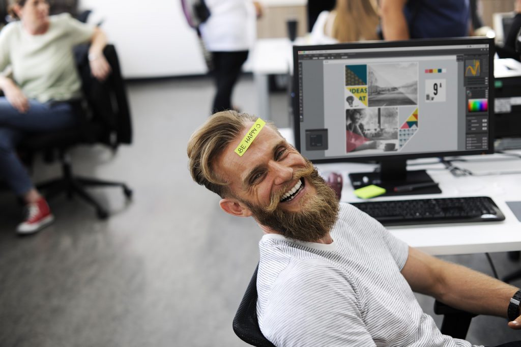 happy adult at work, he is looking after employee mental health