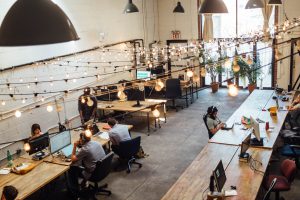 image of desks with lights strewn across for blog by Wellspace on solving absenteeism