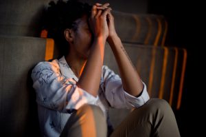 man with his head in his hands suffering stress for Natioanl Stress Awareness Week