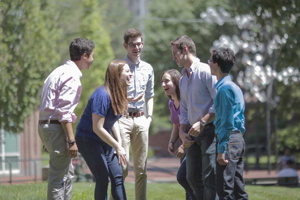 young people in a park who are having a happy 9-5 with corporate  wellness people, Wellspace