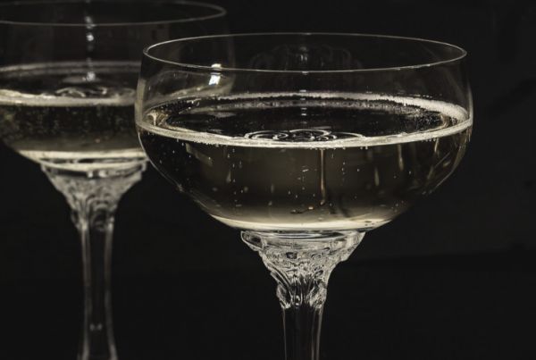 image of champagne glasses for blog by Wellspace on how to stick to new year's resolutions