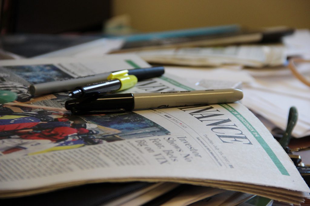 untidy desk for clean off your desk day blog by wellspace, corporate wellness providers