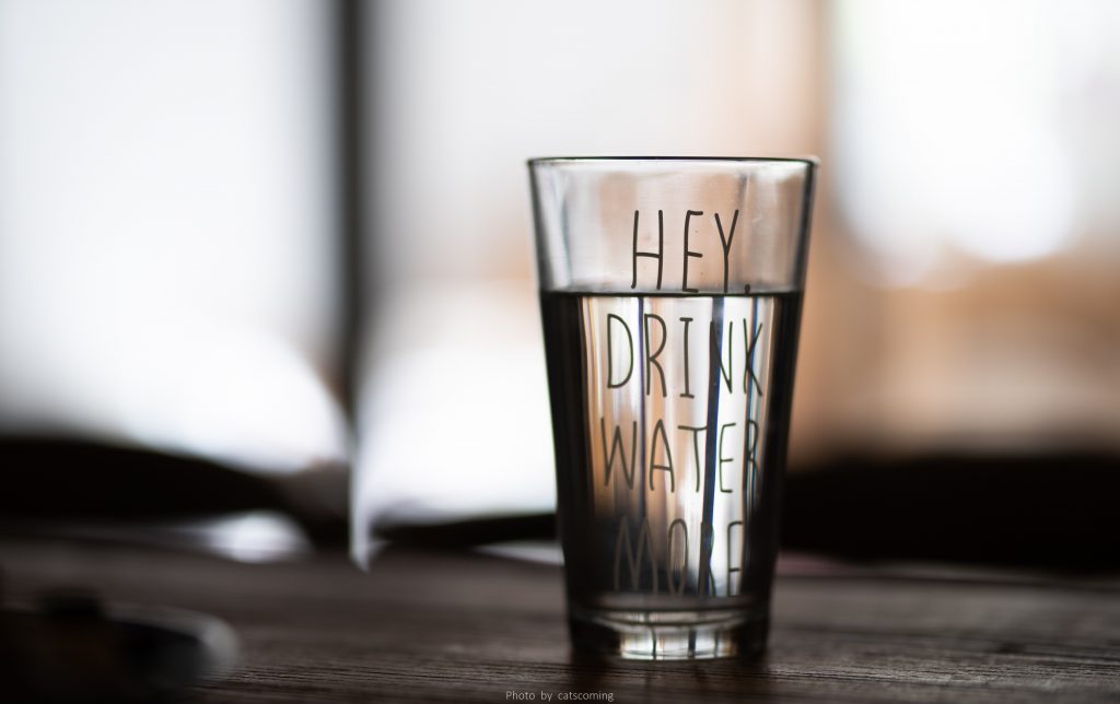 Glass of water for a blog by Wellspace on poor mental health at work and surviving on no sleep