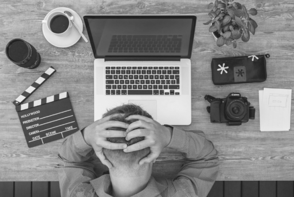 Image of man sat at desk with laptop for Know Your Employee Rights Blog by Wellspace