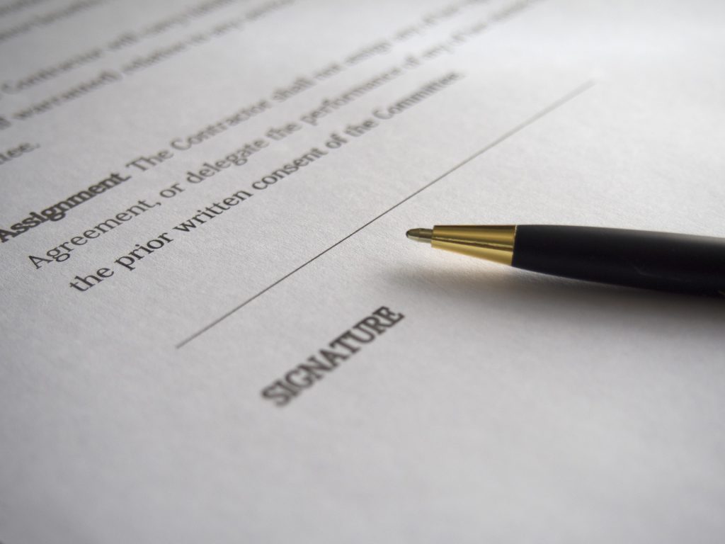 Image of contract and pen for Working Bank Holidays – Know Your Employee Rights blog by Wellspace