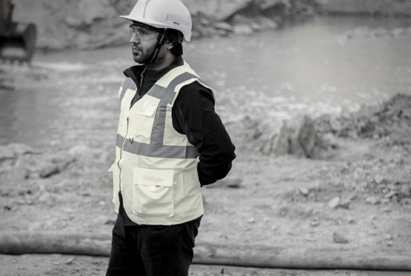 Man in hard hat and high vis jacket for health and wellbeing v health and safety blog