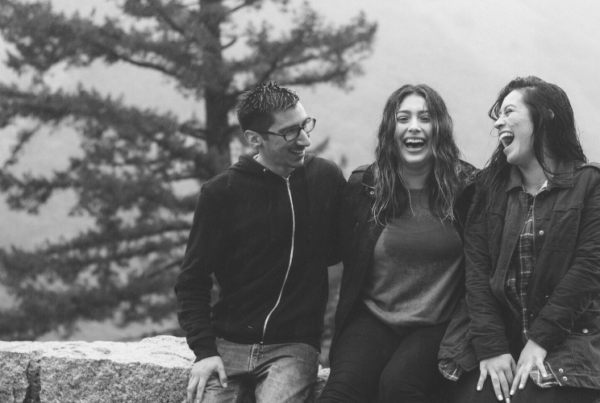 People laughing on a bridge