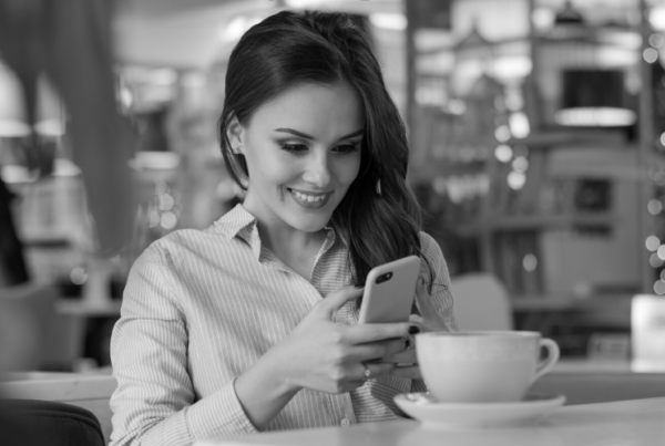 A woman looking at her phone using a wellbeing app