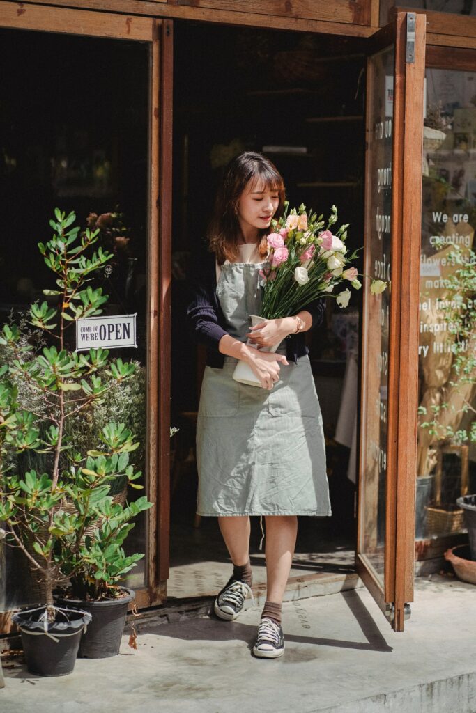 woman with boquet of flowers for an employee reward scheme